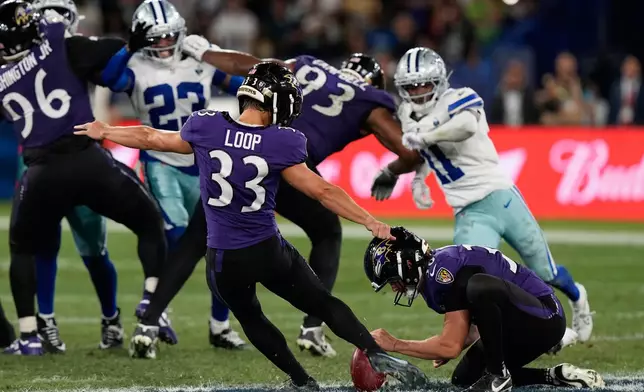 Baltimore Ravens place kicker Tyler Loop (33) kicks the game-winning field goal during the second half of an NFL football game against the Dallas Cowboys in Rio de Janeiro, Sunday, Sept. 27, 2026. (AP Photo/Fernando Llano)