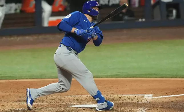 Chicago Cubs' Michael Busch hits a double during the fifth inning of a baseball game against the Miami Marlins Saturday, Sept. 5, 2026, in Miami. (AP Photo/Marta Lavandier)
