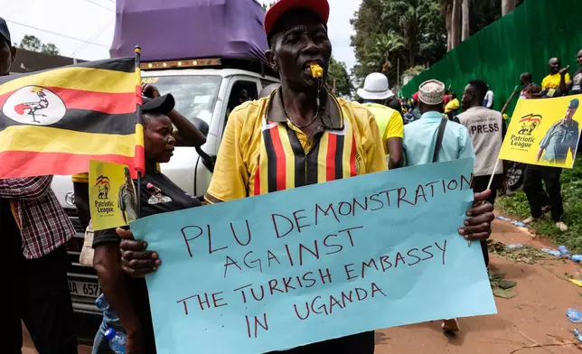 Members of the Patriotic League of Uganda demonstrate outside the Turkish Embassy demanding the extradition of a dissident, Fred Lumbuye, whose online activities are seen by local authorities as anti-government propaganda in Kampala, Uganda, Friday, Sept. 18, 2026. (AP Photo/Hajarah Nalwadda)