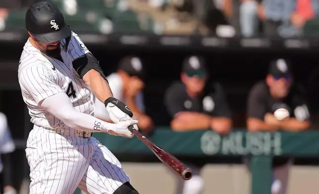 Chicago White Sox's Randal Grichuk hits a two-run home run during the third inning of a baseball game against the Colorado Rockies, Sunday, Sept. 27, 2026, in Chicago. (AP Photo/Melissa Tamez)