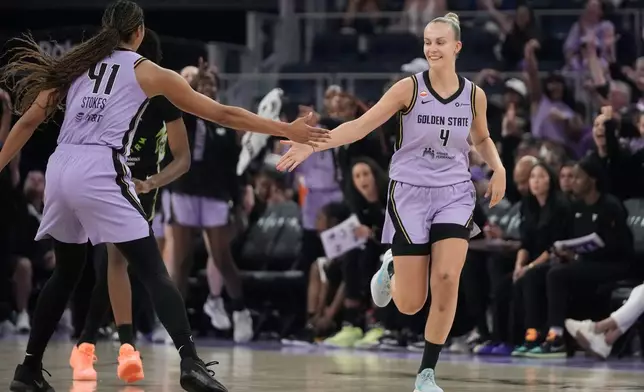 Golden State Valkyries guard Juste Jocyte (4) is congratulated by center Kiah Stokes (41) after scoring during the first half of a WNBA basketball game against the Seattle Storm in San Francisco, Saturday, Sept. 19, 2026. (AP Photo/Jeff Chiu)
