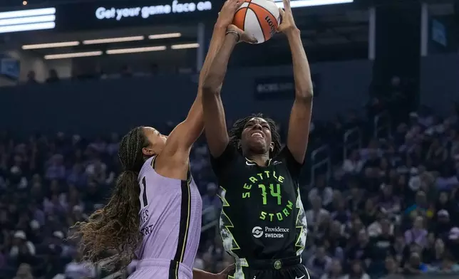 Golden State Valkyries center Kiah Stokes, left, blocks a shot attempt by Seattle Storm center Dominique Malonga (14) during the first half of a WNBA basketball game in San Francisco, Saturday, Sept. 19, 2026. (AP Photo/Jeff Chiu)