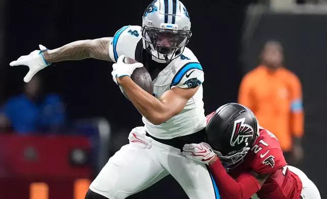 Atlanta Falcons cornerback Mike Hughes (21) tackles Atlanta Falcons wide receiver Jahan Dotson (4) during an NFL football game in Atlanta, Sunday, Sept. 20, 2026. (AP Photo/Mike Stewart)