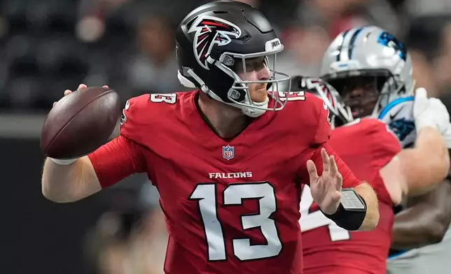 Atlanta Falcons quarterback Cooper Rush (13) passes the ball during an NFL football game against the Carolina Panthers in Atlanta, Sunday, Sept. 20, 2026. (AP Photo/Mike Stewart)