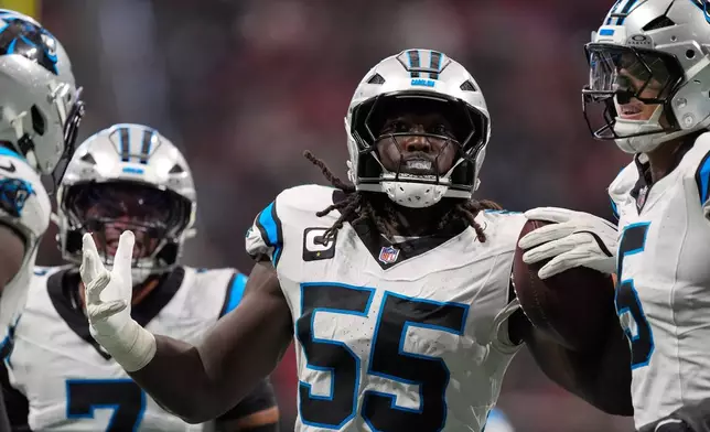 Carolina Panthers linebacker Devin Lloyd (55) celebrates after an interception during an NFL football game against the Atlanta Falcons in Atlanta, Sunday, Sept. 20, 2026. (AP Photo/Mike Stewart)