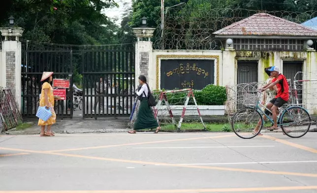 Pedestrians walk past entrance of Insein prison Tuesday, Sept. 15, 2026, in Yangon, Myanmar. (AP Photo)