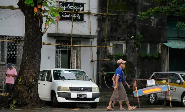 Pedestrians walk past near Pabaedan township court Tuesday, Sept. 15, 2026, in Yangon, Myanmar. (AP Photo)