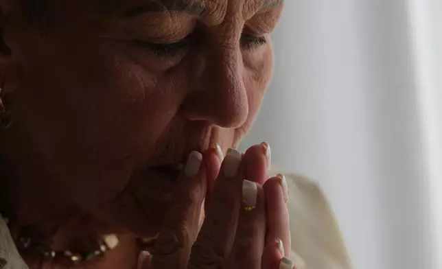 Deb Robertson pauses to reflect during an interview at her home in Lombard, Ill., on Tuesday, Sept. 8, 2026. (AP Photo/Luis Andres Henao)