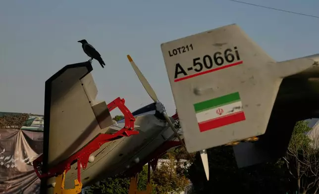 A crow sits on a drone displayed in a military exhibition commemorating the anniversary of the start of the 1980-88 Iraq-Iran war at Baharestan Square, in Tehran, Monday, Sept. 28, 2026. (AP Photo/Vahid Salemi)