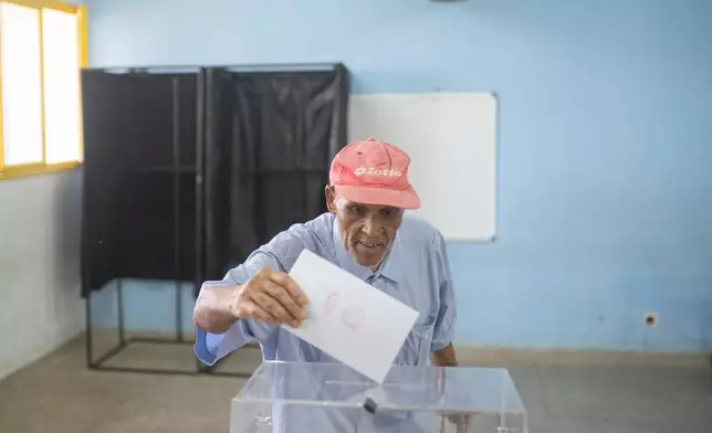 A man casts his vote inside a polling station during the legislative elections in Rabat, Morocco, Wednesday, Sept. 23, 2026. (AP Photo/Mosa'ab Elshamy)