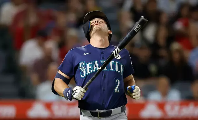 Seattle Mariners' Cole Young (2) reacts after hitting a foul ball during the sixth inning of a baseball game against the Los Angeles Angels, Tuesday, Sept. 15, 2026, in Anaheim, Calif. (AP Photo/Caroline Brehman)
