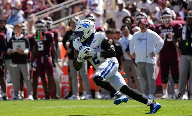 Kentucky's Sam Greene (2) returns an interception against Texas A&M during the first half of an NCAA college football game Saturday, Sept. 19, 2026, in College Station, Texas. (AP Photo/David J. Phillip)