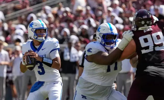 Kentucky quarterback Kenny Minchey (3) throws a pass against Texas A&M during the first half of an NCAA college football game Saturday, Sept. 19, 2026, in College Station, Texas. (AP Photo/David J. Phillip)