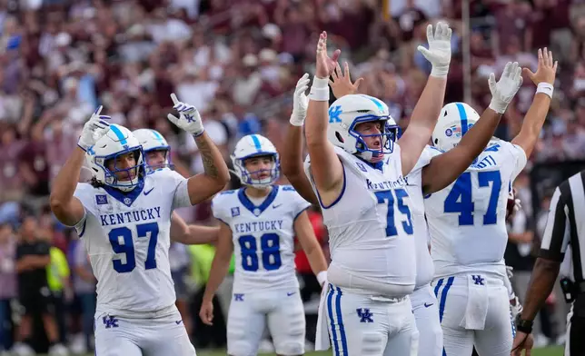 Kentucky players celebrate a field goal by kicker Adam Zouagui (88) during the second half of an NCAA college football game against Texas A&M Saturday, Sept. 19, 2026, in College Station, Texas. (AP Photo/David J. Phillip)
