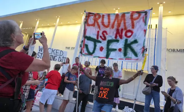 People protest outside the Kennedy Center over the threats by President Donald Trump to demolish the performing arts center, in Washington, Friday, Sept. 18, 2026. (AP Photo/J. Scott Applewhite)