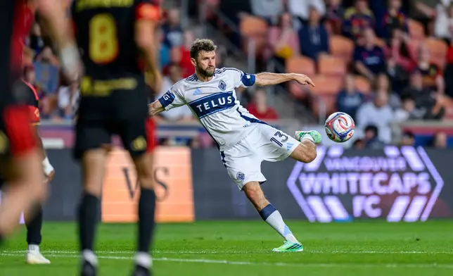 Vancouver Whitecaps midfielder Thomas Müller (13) shoots and scores during an MLS soccer match against the Real Salt Lake, Saturday, Sept. 19, 2026, in Sandy, Utah. (AP Photo/Tyler Tate)
