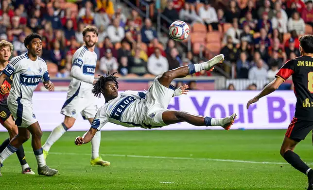 Vancouver Whitecaps forward Emmanuel Sabbi, center, bicycle kicks the ball on goal during an MLS soccer match against Real Salt Lake, Saturday, Sept. 19, 2026, in Sandy, Utah. (AP Photo/Tyler Tate)