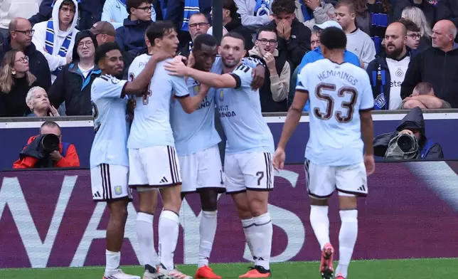 Aston Villa's Nicolas Jackson celebrates with his teammates after scoring his side's third goal during the Champions League opening phase soccer match between Club Brugge and Aston Villa in Bruges, Belgium, Tuesday, Sept. 8, 2026. (AP Photo/Omar Havana)