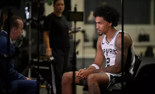 San Antonio Spurs guard Dylan Harper participates in a media interview during the team's NBA basketball media day event, Monday, Sept. 28, 2026, in San Antonio. (AP Photo/Darren Abate)