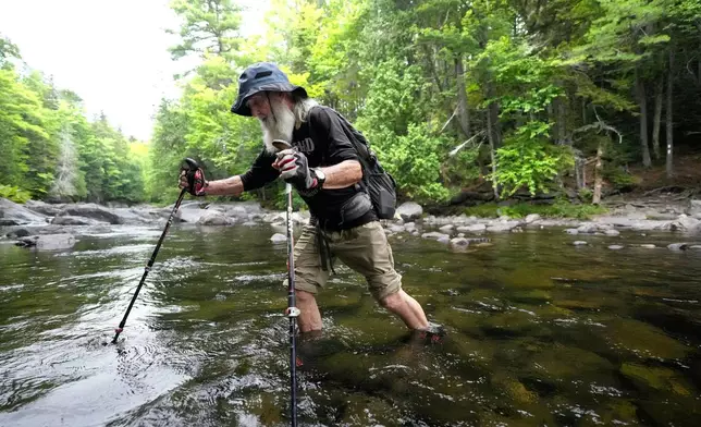 Appalachian Trail hiker Dale Sanders wades across Big Wilson Stream on the 100-Mile Wilderness north of Monson, Maine, Wednesday, July 29, 2026. (AP Photo/Robert F. Bukaty)