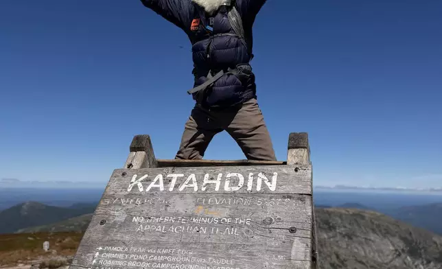 Dale Sanders, 91, celebrates upon completing his hike of the Appalachian Trail at the summit of Mt. Katahdin, Monday, Aug. 31, 2026 in Baxter State Park in Piscataquis County, Maine. (AP Photo/Robert F. Bukaty)
