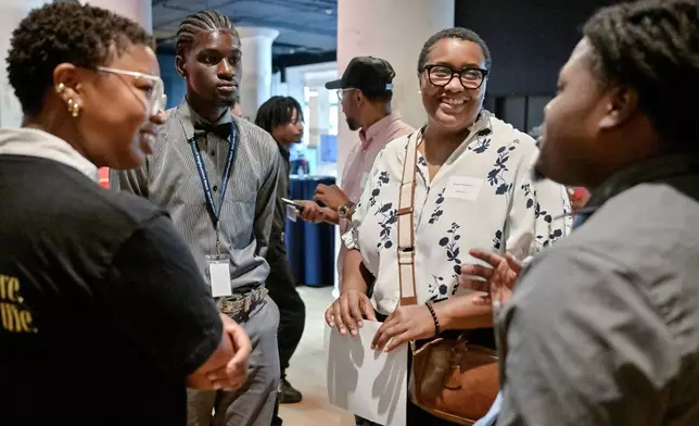 NextUp901 program participants Thylr Holt Wade (left center), and Raymond Knox (right) speak with local employers from Cxffeeblack Sydni Barnes (left) and Renata Henderson (right center) at the NextUp901 launch event in Memphis, Tenn. on Thursday, September 10, 2026. NextUp901 is a citywide, multi-sector youth workforce development initiative designed to foster economic mobility.