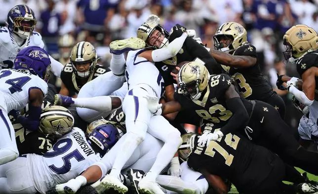 iNew Orleans Saints quarterback Tyler Shough converts on a fourth and one for a first down n the second half of an NFL football game in Baltimore, Sunday, Sept. 20, 2026. (AP Photo/Nick Wass)
