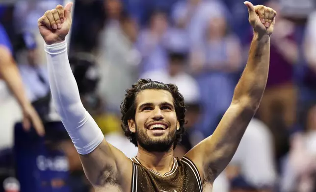 Carlos Alcaraz, of Spain, celebrates winning a match against Jaime Faria, of Portugal, during the second round of the U.S. Open tennis championships, Wednesday, Sept. 2, 2026, in New York. (AP Photo/Adam Hunger)