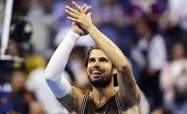 Carlos Alcaraz, of Spain, celebrates winning a match against Jaime Faria, of Portugal, during the second round of the U.S. Open tennis championships, Wednesday, Sept. 2, 2026, in New York. (AP Photo/Adam Hunger)