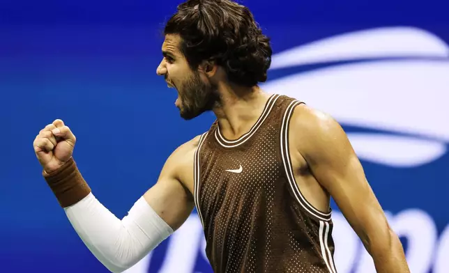Carlos Alcaraz, of Spain, celebrates winning a match against Jaime Faria, of Portugal, during the second round of the U.S. Open tennis championships, Wednesday, Sept. 2, 2026, in New York. (AP Photo/Adam Hunger)