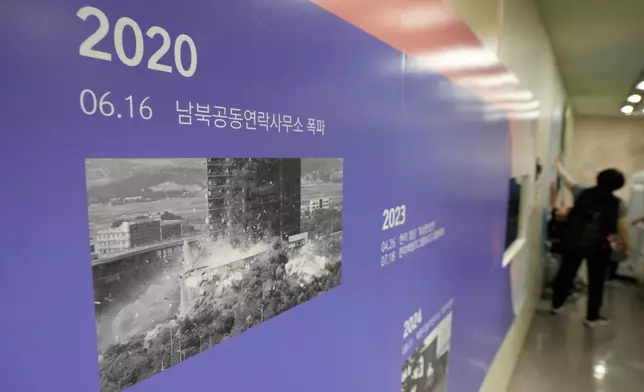 A photo showing the demolition of an inter-Korean liaison office building in Kaesong, North Korea, is displayed at the Unification Observation Post in Paju, South Korea, near the border with North Korea, Wednesday, Sept. 16, 2026. The signs read ''The demolition of an inter-Korean liaison office building.'' (AP Photo/Ahn Young-joon)