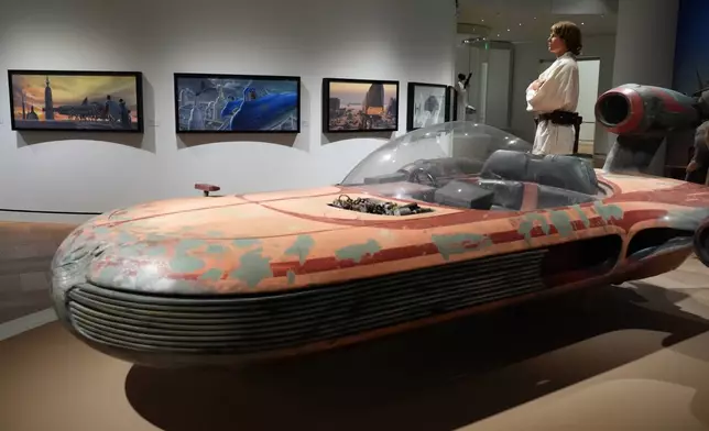 Luke Skywalker's landspeeder from the 1977 film "Star Wars: Episode IV - A New Hope" is pictured in the Cinema Gallery during a preview of the Lucas Museum of Narrative Art on Monday, Aug. 31, 2026, in Los Angeles. (AP Photo/Chris Pizzello)