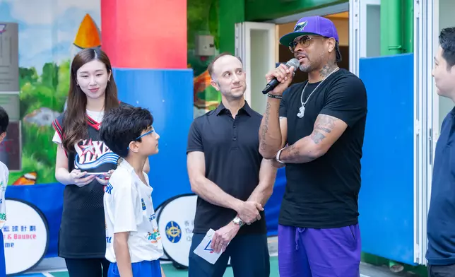 Allen Iverson speaks to a student about resilience, overcoming adversity.