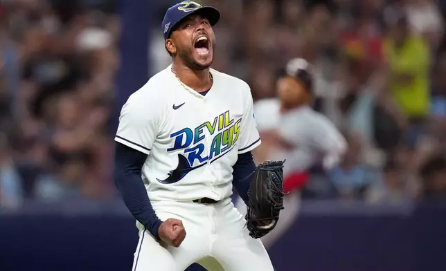 Tampa Bay Rays pitcher Freddy Peralta celebrates the last out in the top of the fifth inning in Game 2 of an American League Championship Series baseball game against the Cleveland Guardians in St. Petersburg, Fla. Tuesday, Oct. 13, 2026. (AP Photo/David J. Phillip)