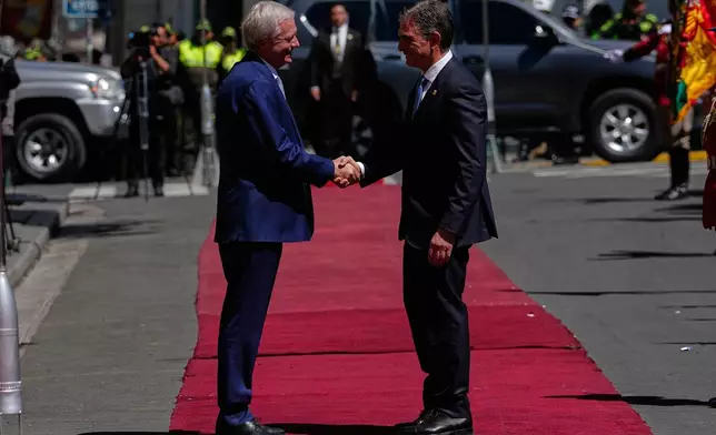 Bolivian President Rodrigo Paz, right, receives Chile's President Jose Antonio Kast at the government palace in La Paz, Bolivia, Friday, Oct. 16, 2026. (AP Photo/Juan Karita)
