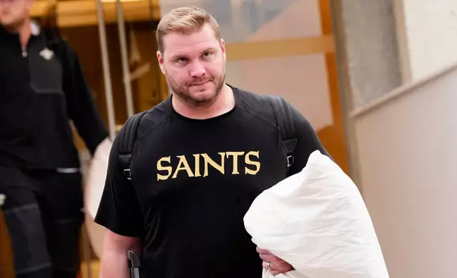 New Orleans Saints' David Edwards arrives at the reception pavilion of Charles de Gaulle airport in Roissy north of Paris, Monday, Oct. 19, 2026. (AP Photo/Teresa Suarez)