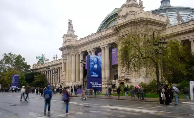 Paris' Grand Palais hosting Art Basel art fair is pictured Friday, Oct. 23, 2026 after planned anti-government protests prompted organizers to cancel their weekend program. (AP Photo/Teresa Suarez)