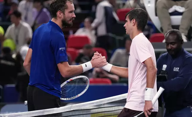 Spain's Rafael Jodar is congratulated by Russia's Daniil Medvedev after winning the men's singles semifinal match at the Shanghai Masters tennis tournament in Shanghai, China, Saturday, Oct. 17, 2026. (AP Photo/Andy Wong)