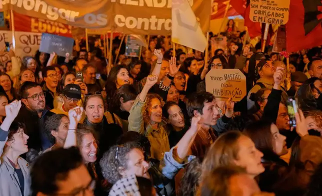 Protesters gather during a demonstration demanding affordable housing outside Portugal's Parliament in Lisbon, Tuesday, Oct. 27, 2026.(AP Photo/Armando Franca)