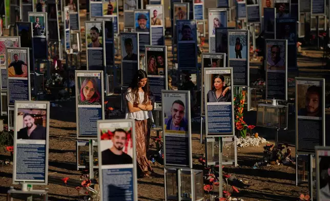 People mark the third anniversary of the Oct. 7, 2023, Hamas-led attack on Israel at the site of the Nova music festival, where hundreds of revelers were killed and abducted, near Kibbutz Reim, southern Israel, Wednesday, Oct. 7, 2026. (AP Photo/Ohad Zwigenberg)