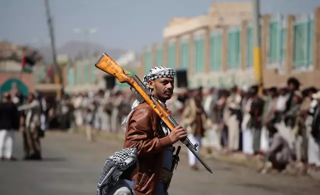 A Houthi supporter carries a rifle while attending an armed tribal rally in Sanaa, Yemen, Wednesday, Oct. 7, 2026. (AP Photo/Osamah Abdulrahman)
