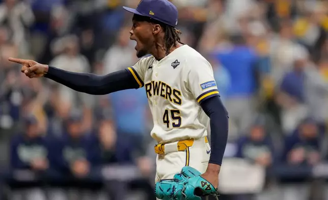 Milwaukee Brewers pitcher Abner Uribe celebrates after a play during the sixth inning of Game 1 of baseball's World Series, Friday, Oct. 23, 2026, in Milwaukee, between the Milwaukee Brewers and the Tampa Bay Rays. (AP Photo/Ashley Landis)