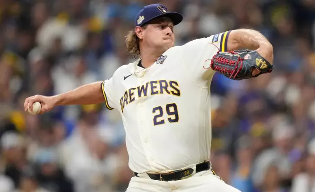 Milwaukee Brewers pitcher Trevor Megill throws during the ninth inning of Game 1 of baseball's World Series, Friday, Oct. 23, 2026, in Milwaukee, between the Milwaukee Brewers and the Tampa Bay Rays. (AP Photo/Kayla Wolf)