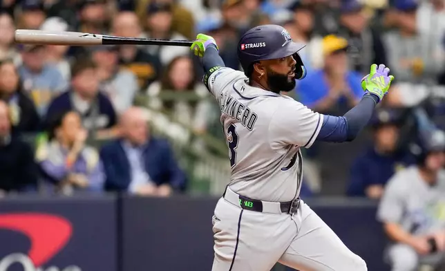Tampa Bay Rays third baseman Junior Caminero follows through on a double during the fourth inning of Game 1 of baseball's World Series, Friday, Oct. 23, 2026, in Milwaukee, between the Milwaukee Brewers and the Tampa Bay Rays. (AP Photo/Ashley Landis)