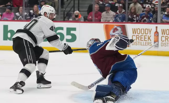 Colorado Avalanche goaltender Mackenzie Blackwood, right, stops a shot fby Los Angeles Kings right wing Joel Armia in the second period of an NHL hockey game Wednesday, Sept. 30, 2026, in Denver. (AP Photo/David Zalubowski)