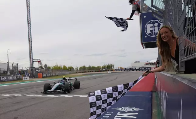 Mercedes driver Andrea Kimi Antonelli of Italy crosses the finish line to win the Formula One U.S. Grand Prix auto race in Austin, Texas, Sunday, Oct. 25, 2026. (Dustin Safranek/Pool Photo via AP)