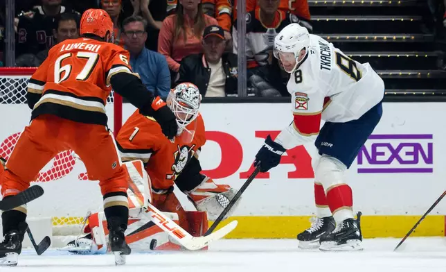 Anaheim Ducks goaltender Lukas Dostal (1) blocks the shot by Florida Panthers left wing Brady Tkachuk (8) during the second period of an NHL hockey game, Sunday, Oct. 4, 2026, in Anaheim, Calif. (AP Photo/Kyusung Gong)