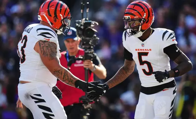 Cincinnati Bengals wide receiver Tee Higgins (5) celebrates a touchdown during the second half of an NFL football game against the Baltimore Ravens in Baltimore, Sunday, Oct. 25, 2026. (AP Photo/Stephanie Scarbrough)
