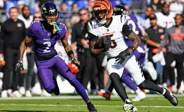 Cincinnati Bengals wide receiver Tee Higgins (5) runs the ball during the second half of an NFL football game against the Baltimore Ravens in Baltimore, Sunday, Oct. 25, 2026. (AP Photo/Nick Wass)