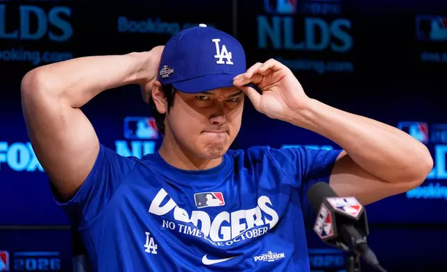 Los Angeles Dodgers' Shohei Ohtani speaks during a news conference ahead of a baseball NL Division Series Friday, Oct. 2, 2026, in Los Angeles. (AP Photo/Mark J. Terrill)